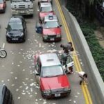 Christmas Miracle in Hong Kong – Security van spills $2 millions on busy road
